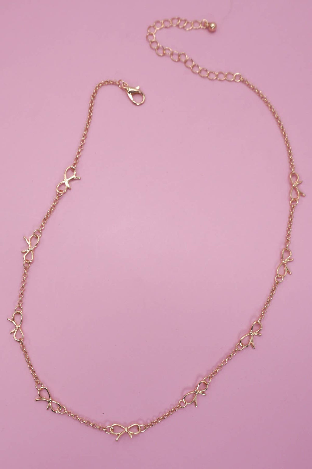 CUTOUT BOW NECKLACE