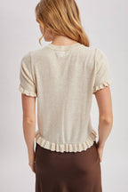 RUFFLED HEM SHORT SLEEVED KNIT SWEATER