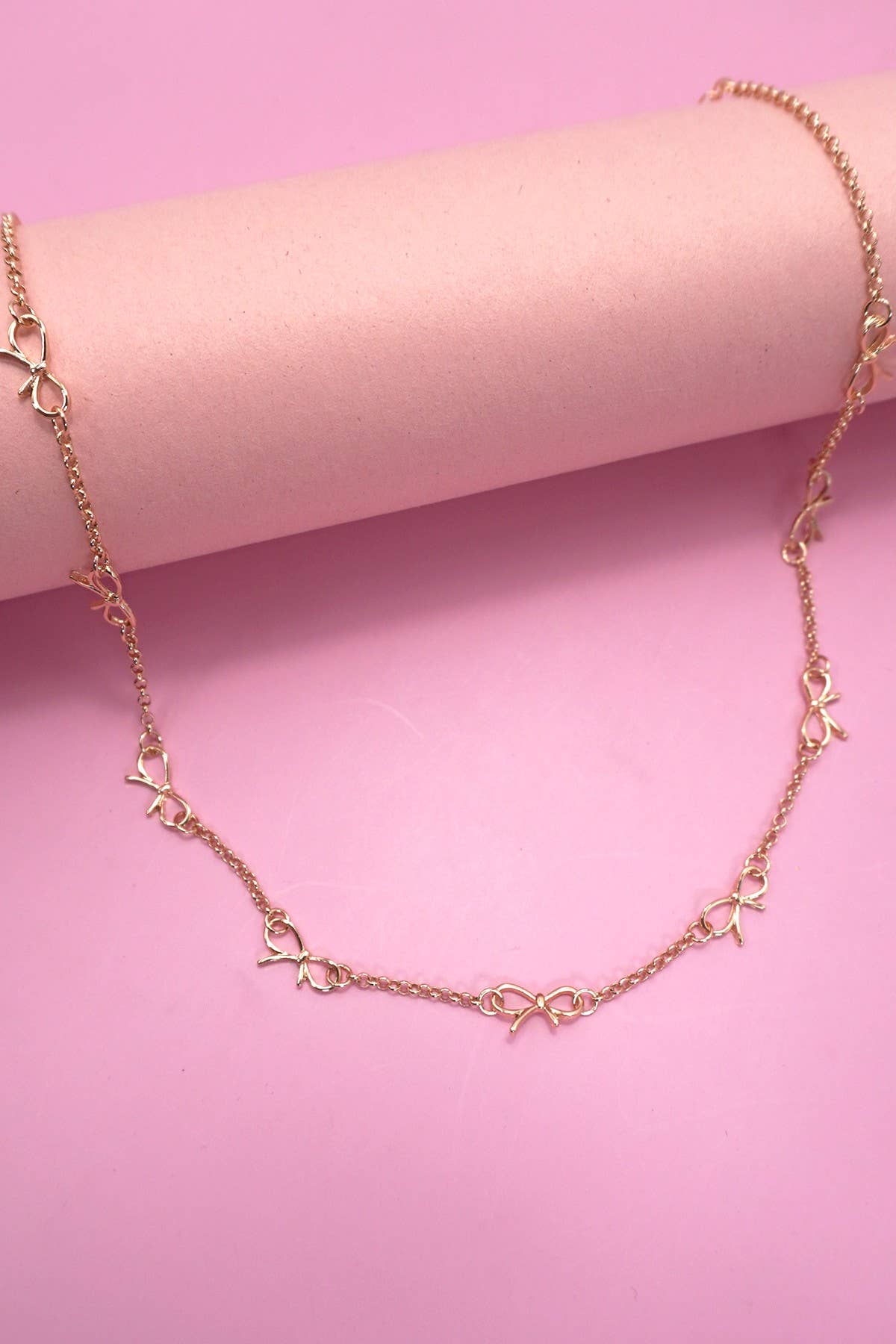 CUTOUT BOW NECKLACE